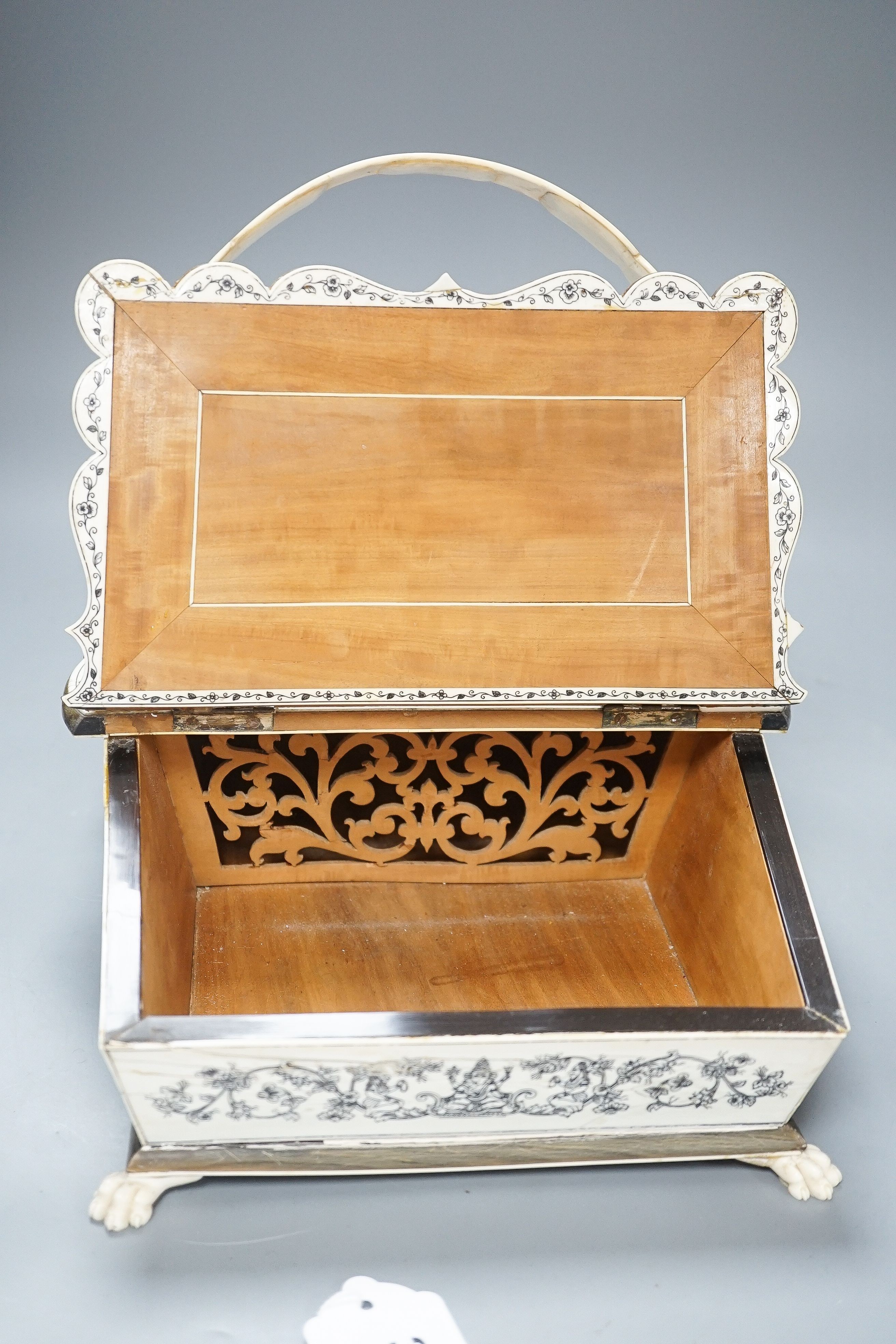 A 19th century Vizagatapatam Ivory and horn swing basket 32cm